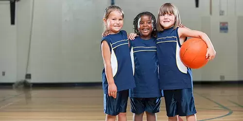 Girls playing YMCA basketball