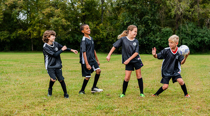 YMCA kids playing youth soccer