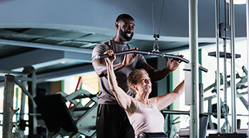 Active Older Adult with a Personal Trainer - YMCA Personal Trainer