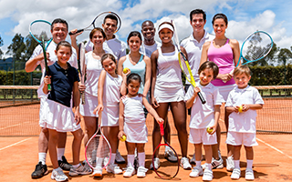 family on tennis court
