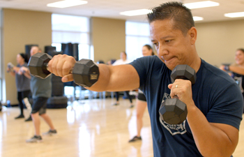 Man boxing with dumbbell