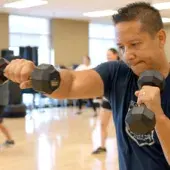 Man boxing with dumbbell