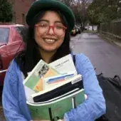 Latino Achievers student holding books