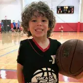 kid holding basketball