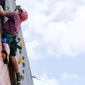 Camper climbs a tower at the Joe C. Davis YMCA Outdoor Center