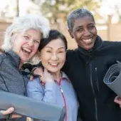 three active older adult women smiling 