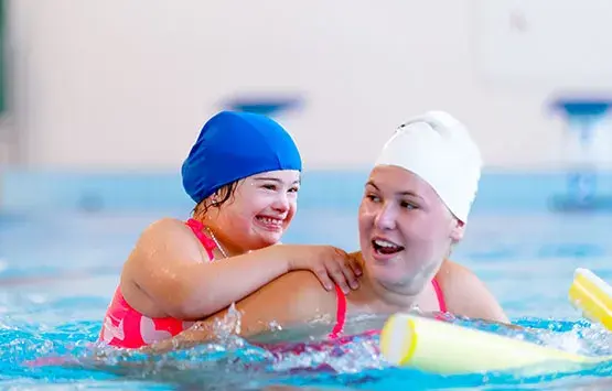 Special needs child taking swim lessons