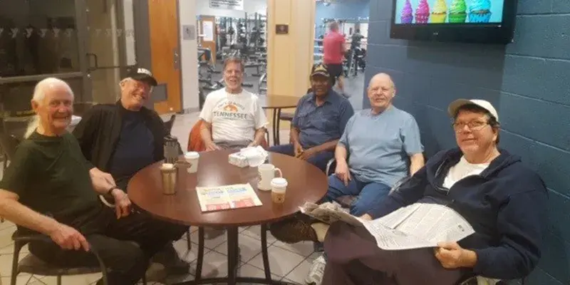 Roger and his friends at the Liars’ Table