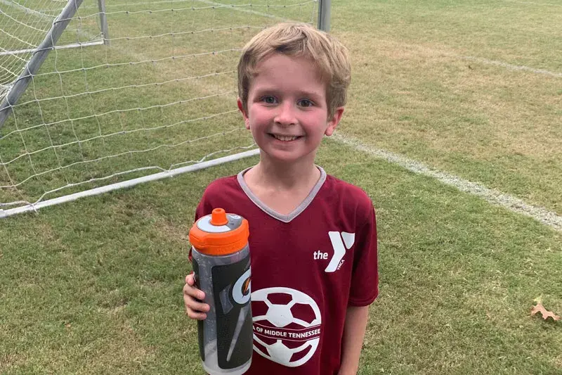 young boy on soccer field