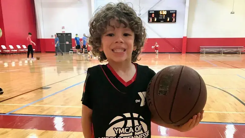 kid with basketball