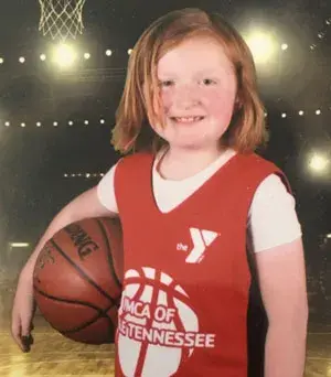 young girl with basketball