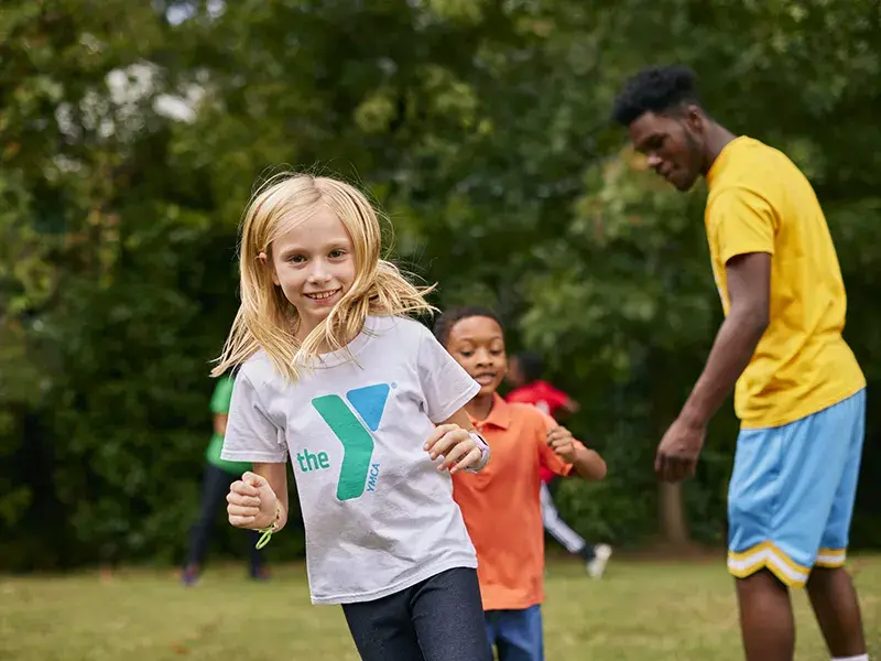young girl playing at camp