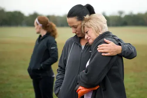 Amanda consoling Angi's mother, Charlotte
