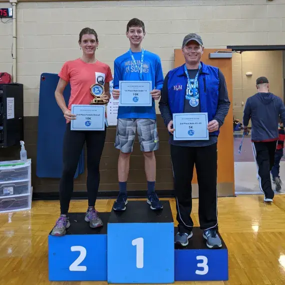 family standing on podium