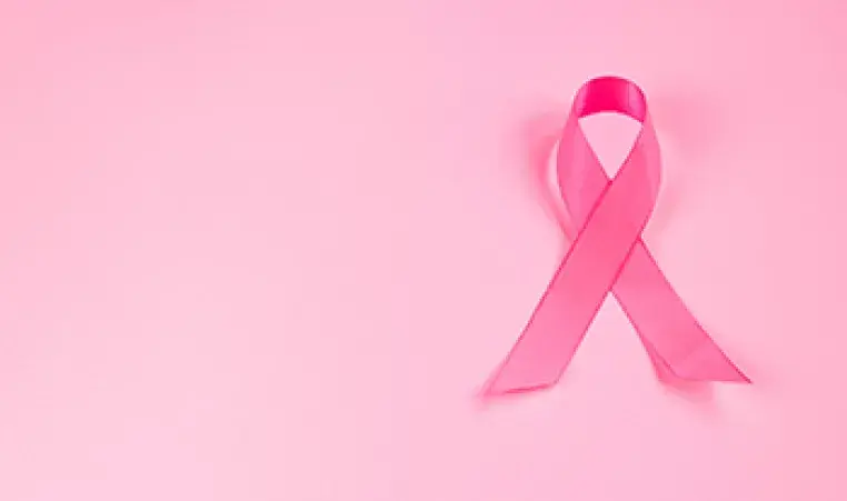 pink ribbon on pink background