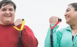 Couple working out with resistance bands