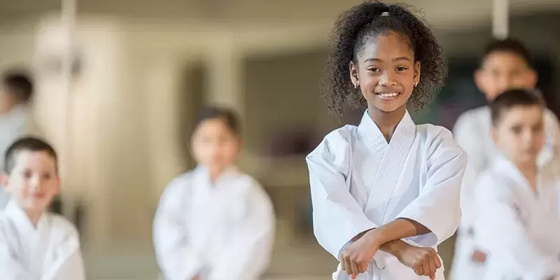 Kids at a YMCA martial arts class