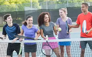 teens on tennis court