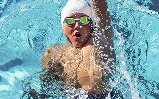 Kid swimming in pool