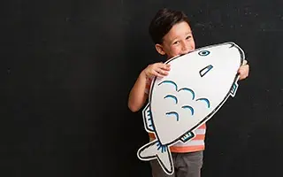 kid holding fish drawing