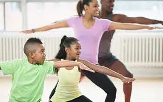 Family doing yoga together.