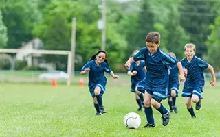 Youth-soccer-team-boy-kicking-ball